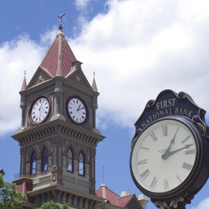 This timeless clocks canvas print makes for a scenic statement in your living spaces. This image shows the four-faced clock on the Bosque County Courthouse and the First National Bank on the street beside it. It shows streetpost clock are in sync, but the angle of the shot makes it a question of which ones are right...or wrong. This is in the courthouse square in Meridian, Texas.