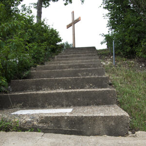 Pictured is 12 steps leading to a cross. This lone cross canvas print reflects faith and perseverance.  This image is more than a staircase and a cross. It's a visual metaphor for purpose, sacrifice, hope, and the courage to keep climbing.